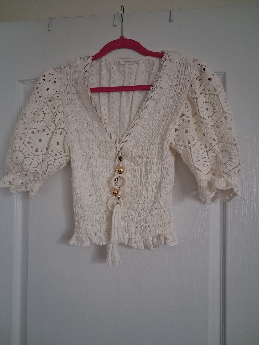 Ivory Crochet-Sleeve Smocked Tassel Blouse